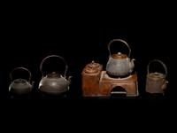 Four Japanese Cast Iron Teapots, Tetsubin , and Copper Burner Stand