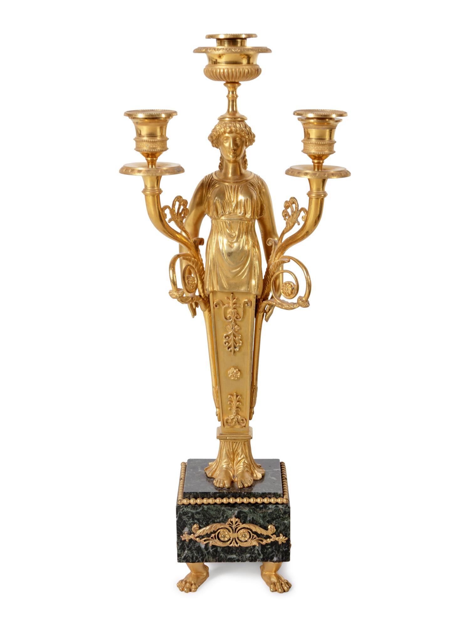 An Empire Style Gilt and Patinated Bronze and Marble Clock Garniture