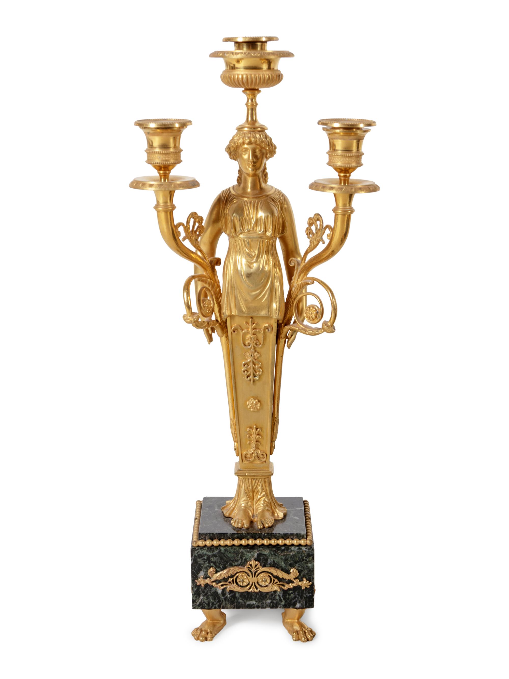 An Empire Style Gilt and Patinated Bronze and Marble Clock Garniture