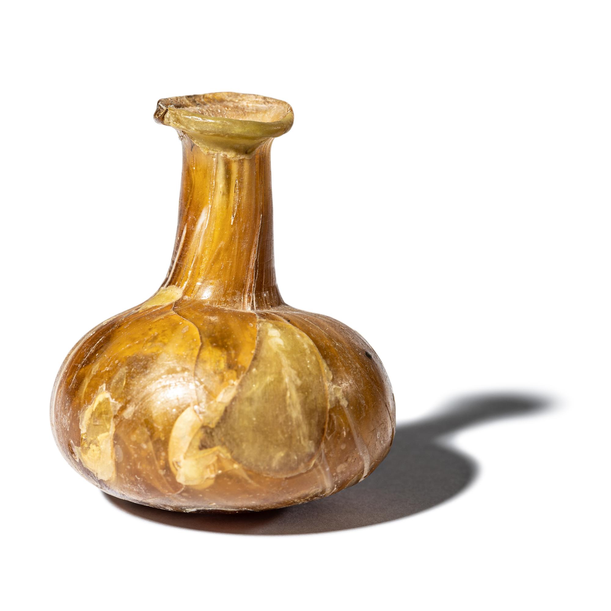 A Roman Marbled Yellow Glass Bottle