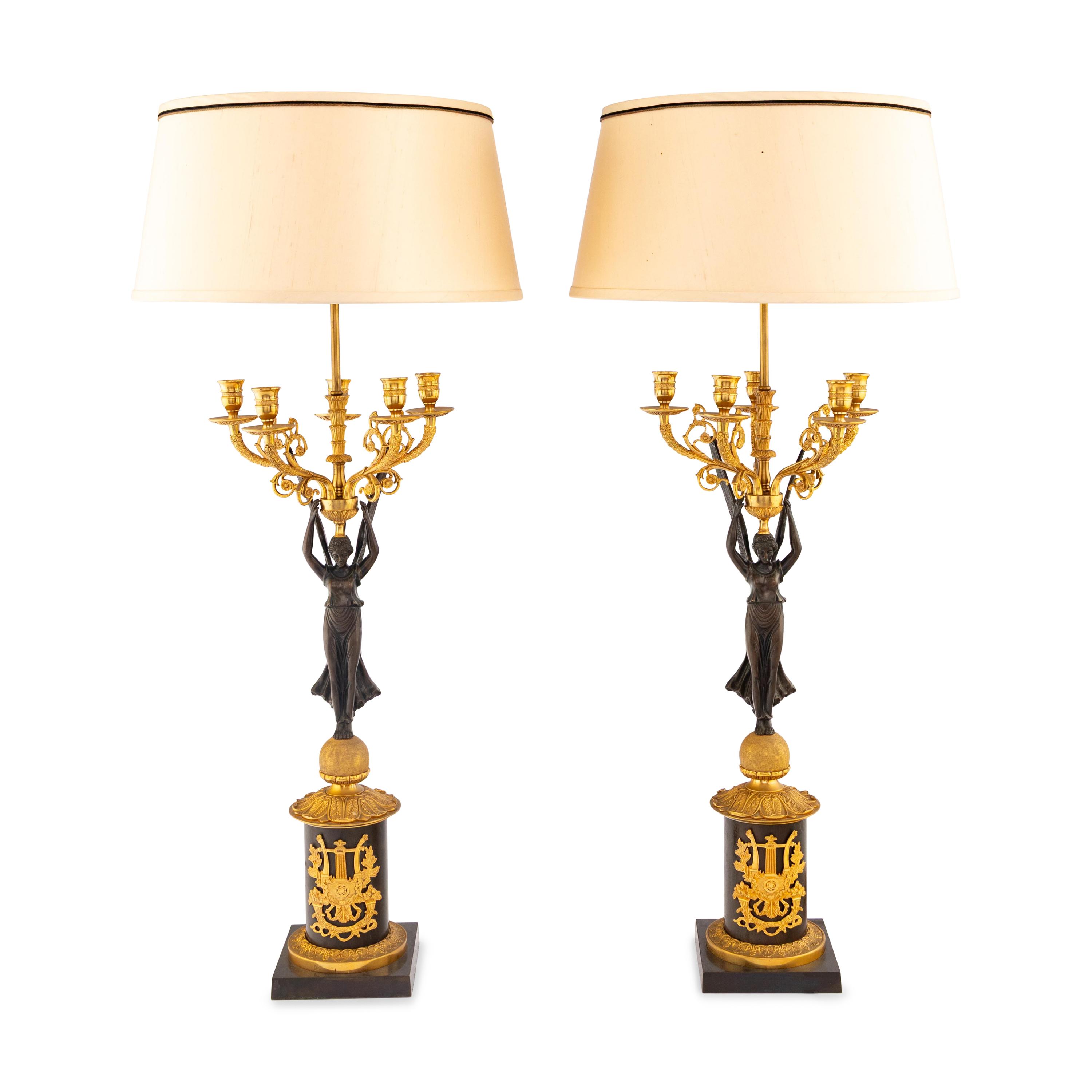A Pair of Empire Style Gilt and Patinated Bronze Candelabra Mounted as Lamps