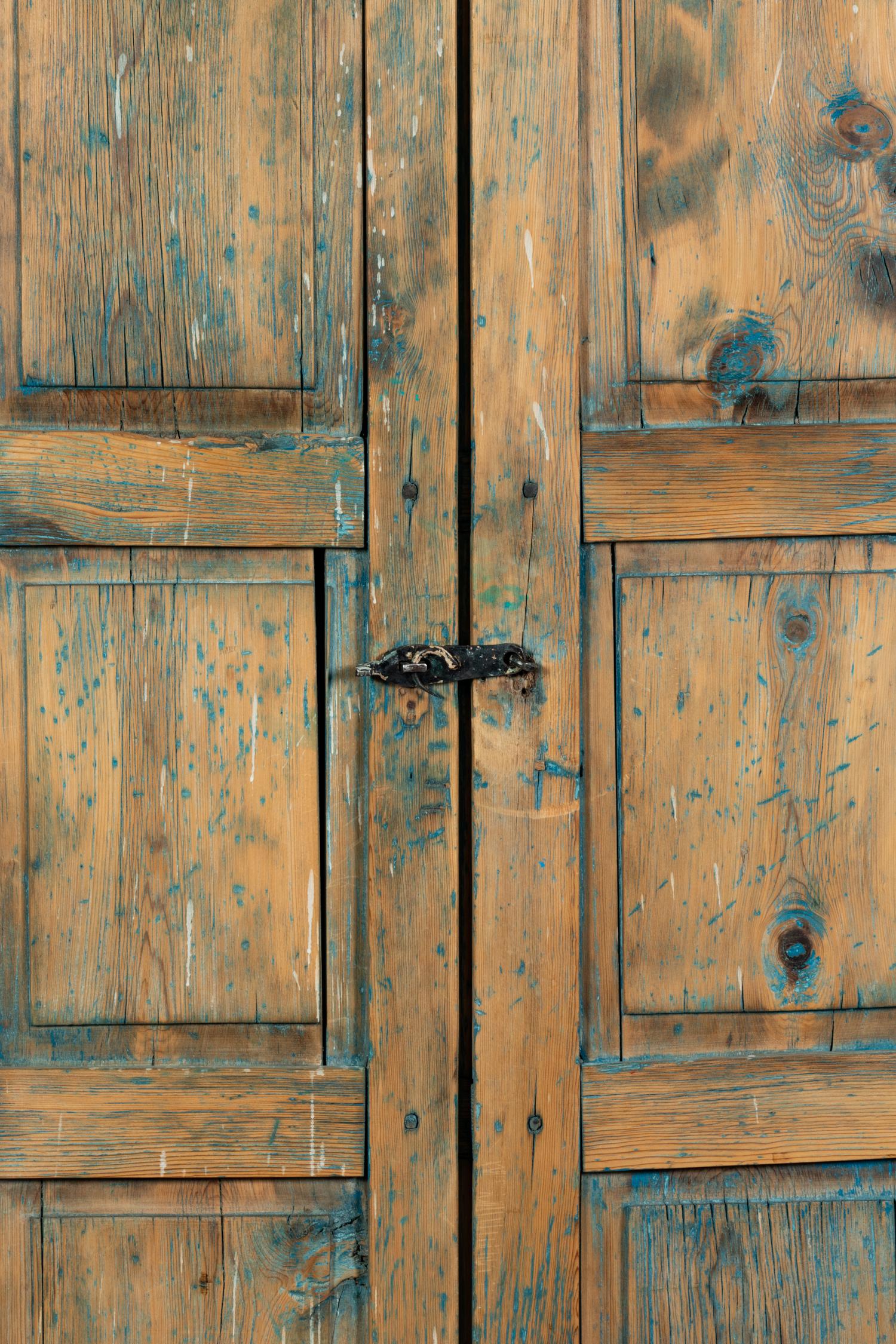 A Painted Rustic Cabinet in Two Pieces