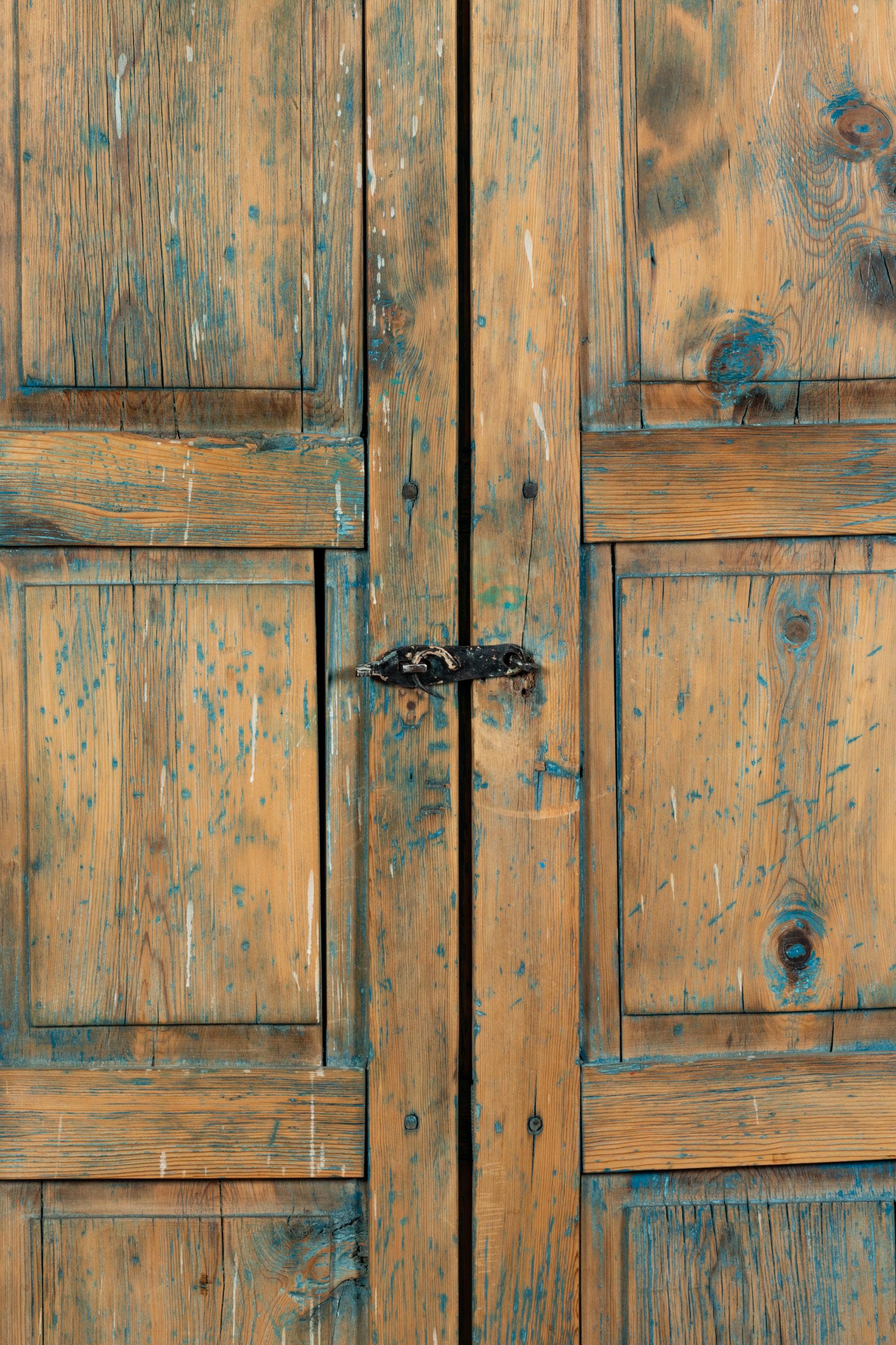 A Painted Rustic Cabinet in Two Pieces