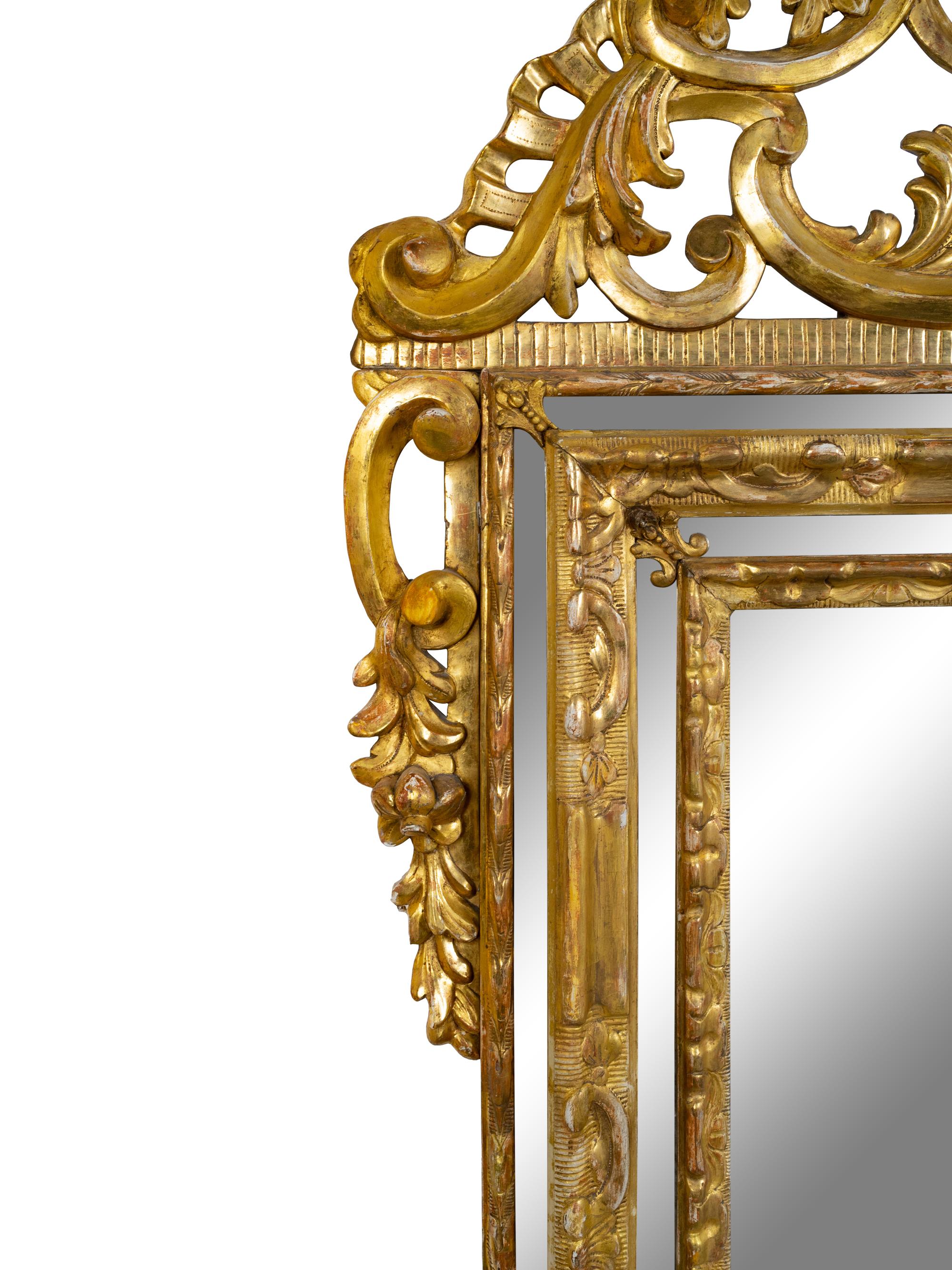 An Italian Baroque Style Giltwood Mirror