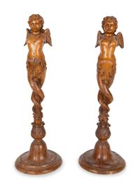 A Pair of Italian Carved Walnut Putti on Fluted Bases — 18TH/19TH CENTURY