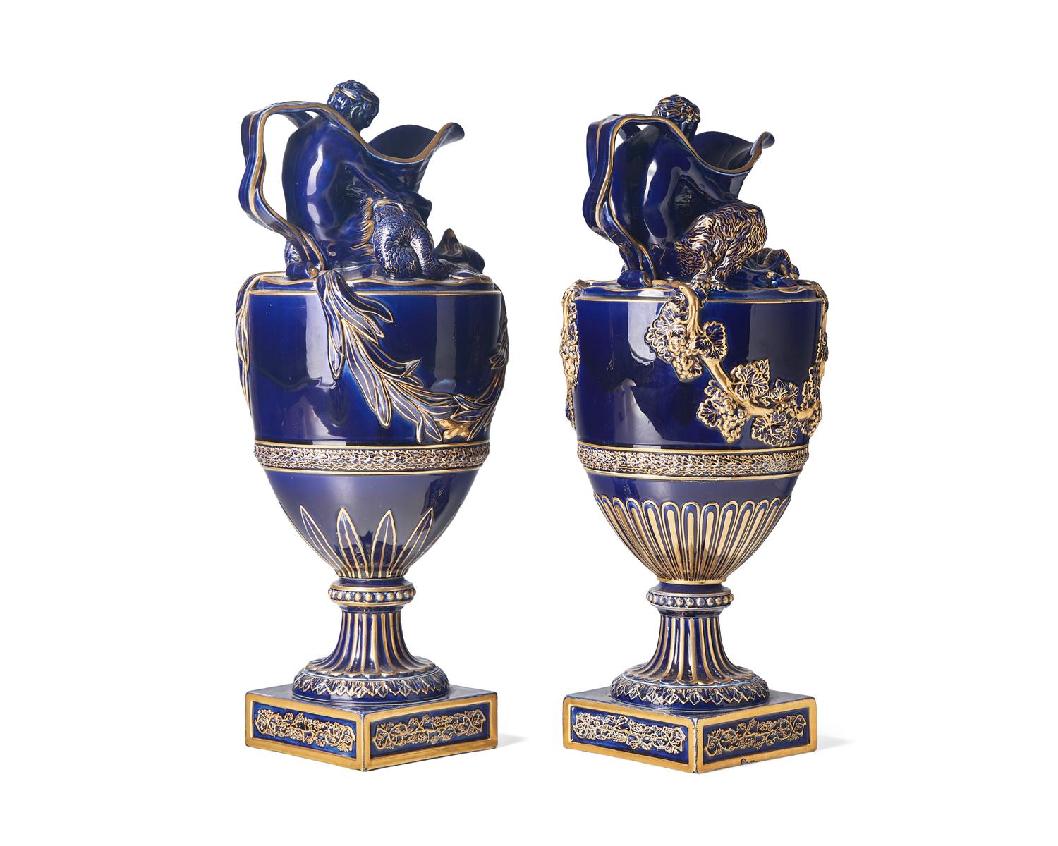 A Pair of Wedgwood Parcel Gilt Cobalt Glazed Ewers