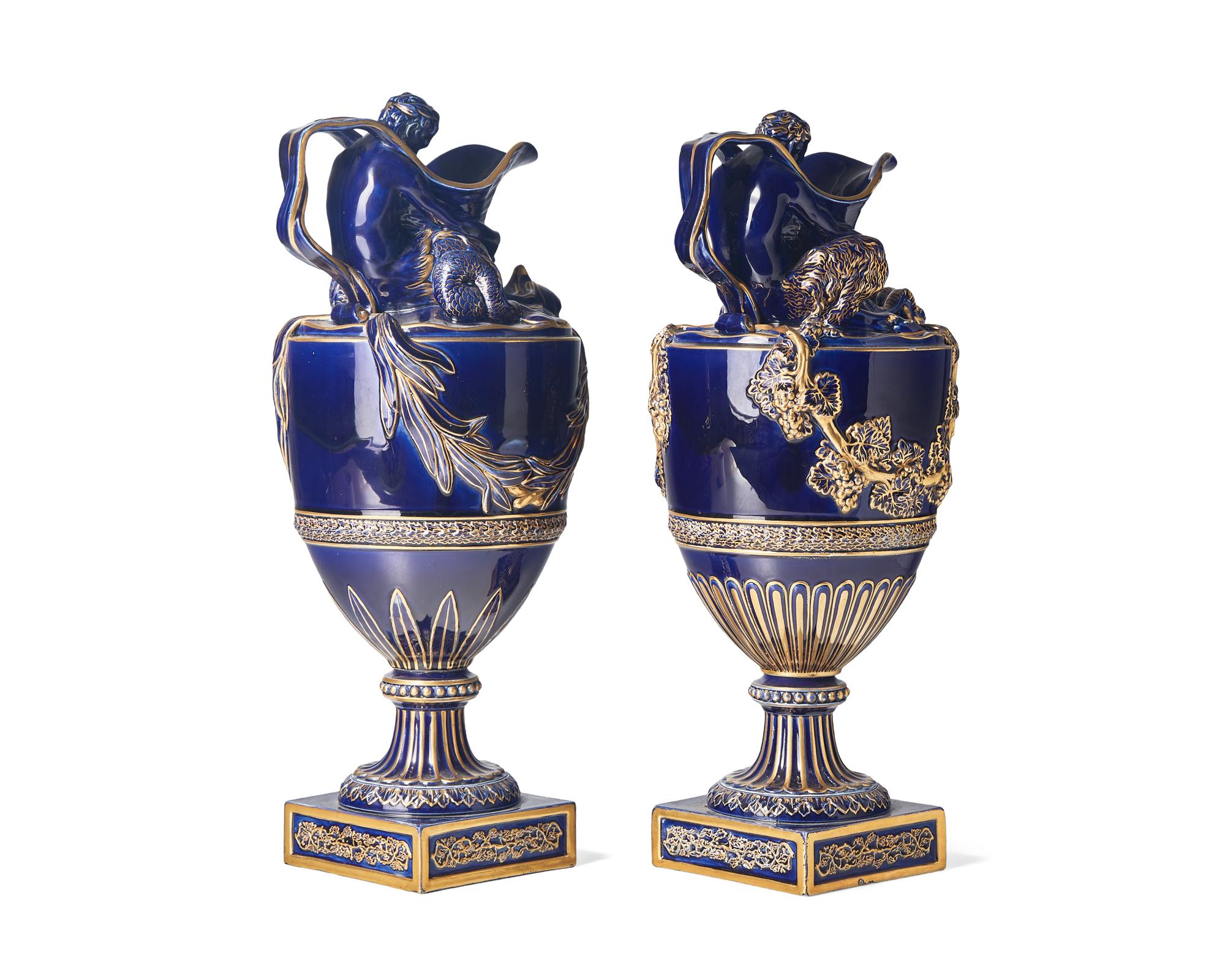 A Pair of Wedgwood Parcel Gilt Cobalt Glazed Ewers
