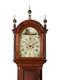 A Federal Carved and Inlaid, Brass-Mounted Mahogany Tall Case Clock