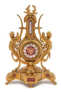 A French Neoclassical Porcelain Mounted Gilt Metal Mantel Clock Height 19 x width 12 1/2 x depth 2 1/2 inches. — LATE 19TH CENTURY