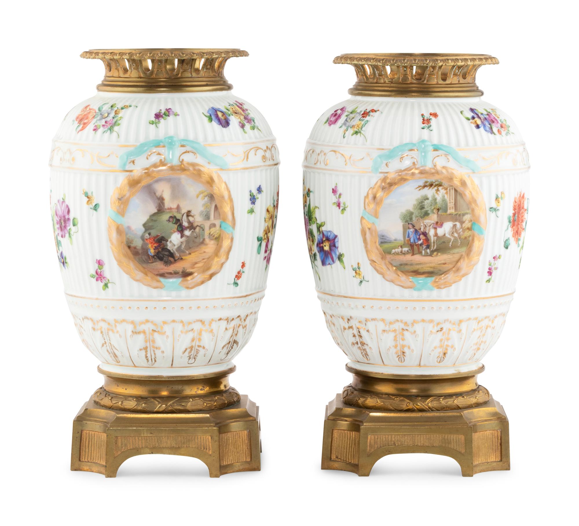 A Pair of German Gilt Bronze Mounted Porcelain Urns