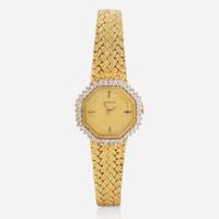A Ladies 14K Yellow Gold and Diamond Watch