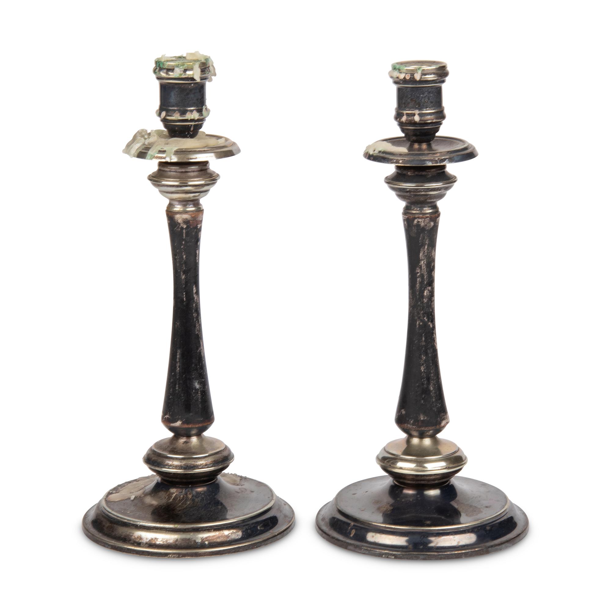 A Pair of Alpaca Silver and Black-Painted Wood Candlesticks