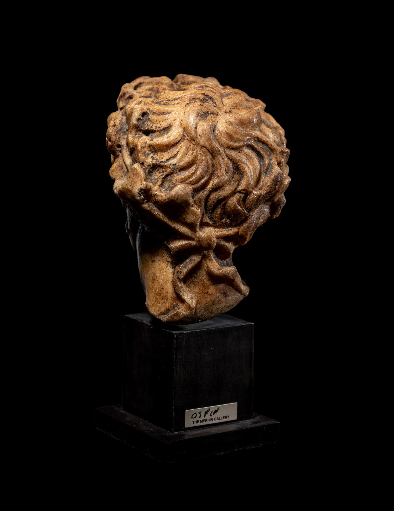 A Roman Marble Head of a Satyr