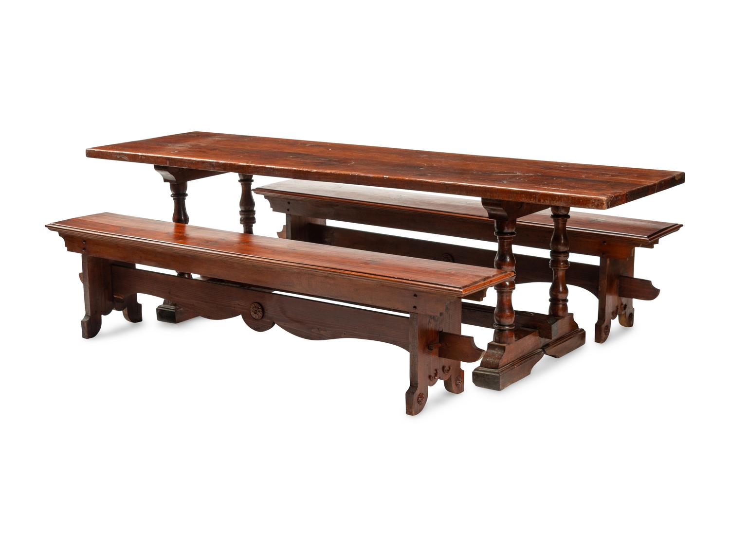 An English Baroque Style Walnut Trestle Table and a Pair of Associated Benches