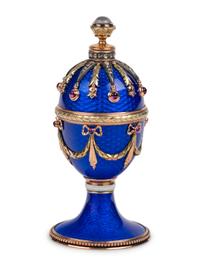 A 14 Karat Vari-Color Gold, Guilloché Enamel, Diamond, and Cabochon Jewel-Mounted Egg-Form Perfume and a Related Guilloché Enamel, 14 Karat Vari-Color Gold, Diamond, and Cabochon-Mounted Surprise Egg