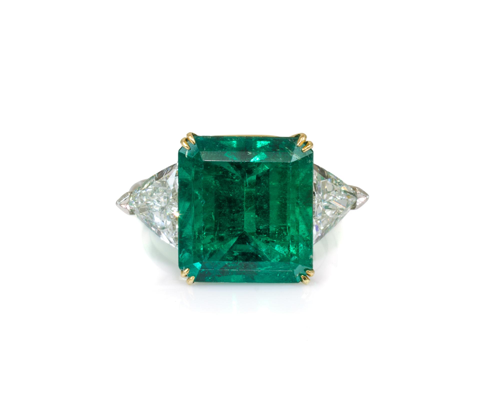 A Platinum, 18 Karat Yellow Gold, Emerald and Diamond Ring, Harry Winston, 6.20 dwts.