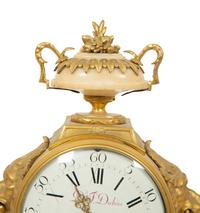 A Louis XVI Gilt Bronze and Marble Mantel Clock