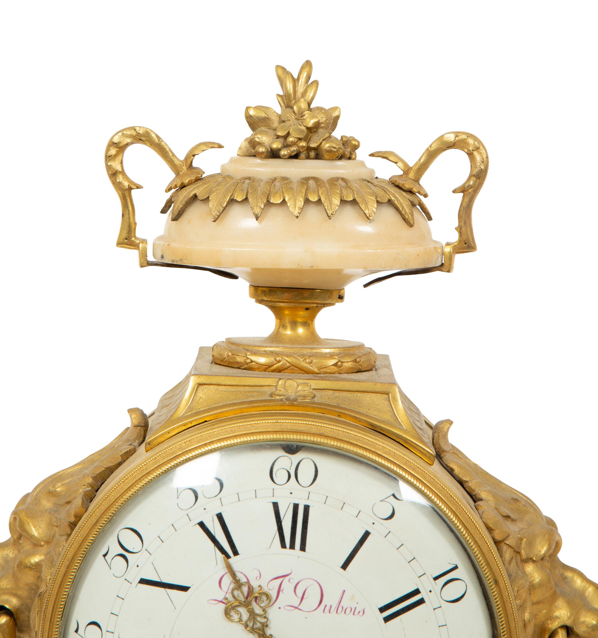 A Louis XVI Gilt Bronze and Marble Mantel Clock