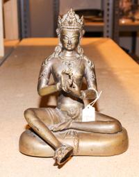A Southeast Asian Brass Figure. Height 11 inches.