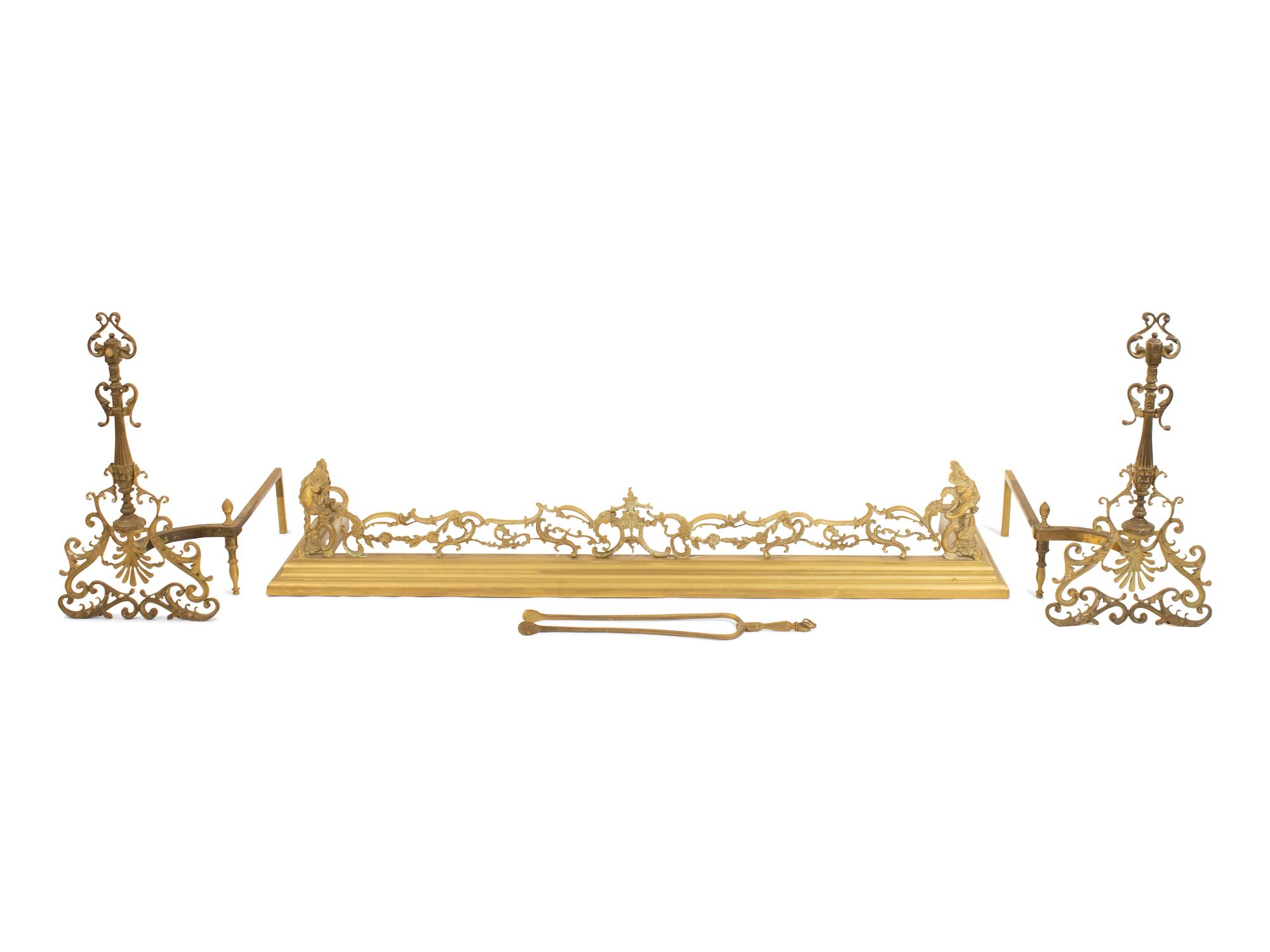 A Pair Continental Brass Andirons and a Fire Fender — LATE 19TH CENTURY