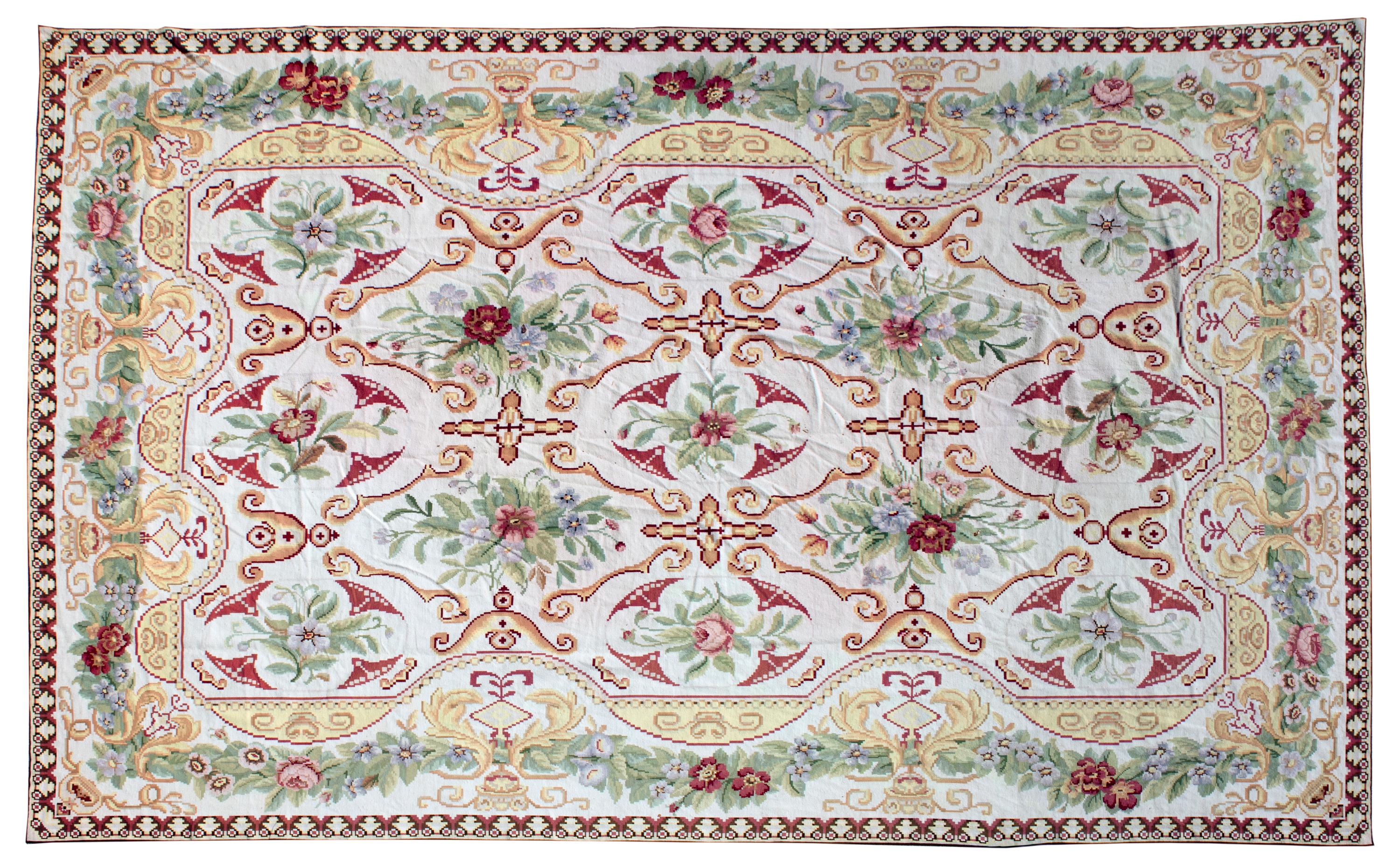 A Needlework Wool Rug — 20TH CENTURY