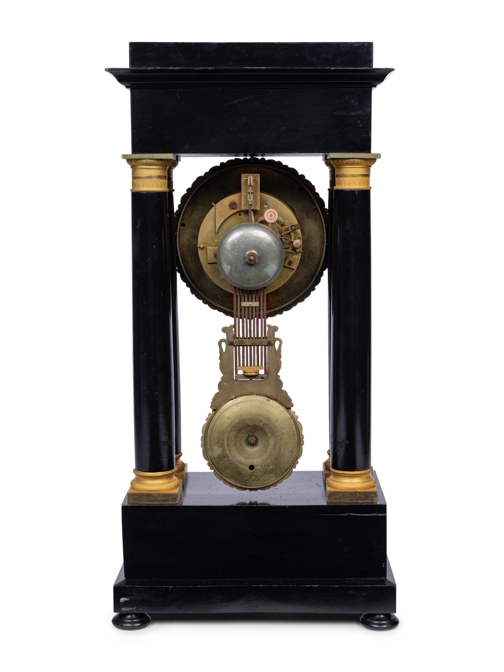 A Charles X Gilt Bronze Mounted Ebonized Portico Clock