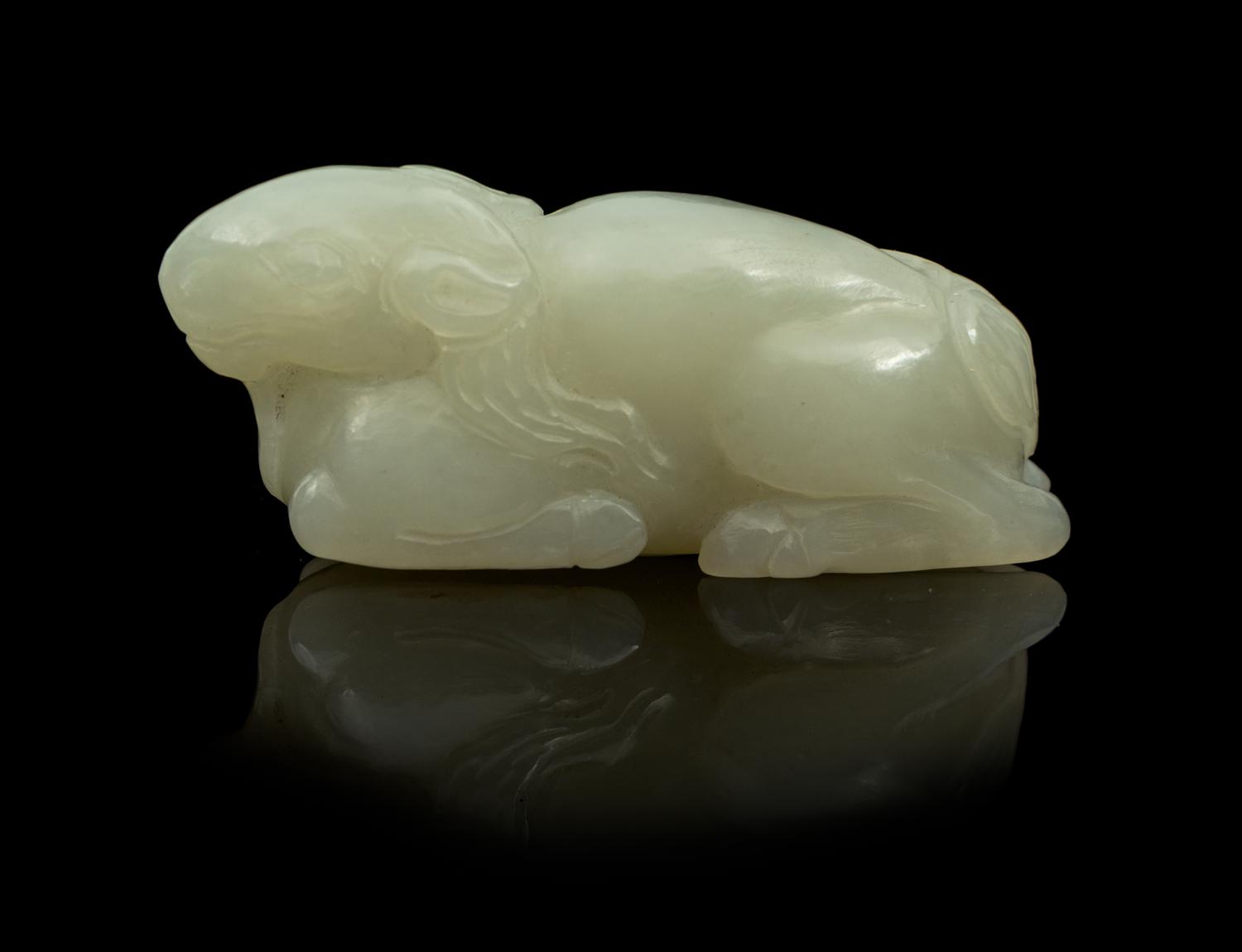 A Carved Jade Toggle Length 2 1/2 inches.