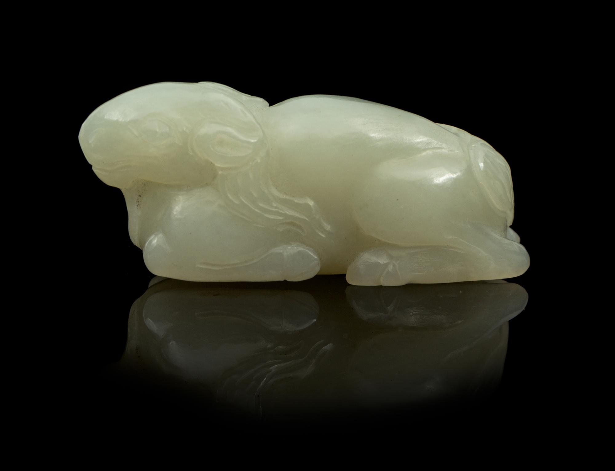 A Carved Jade Toggle Length 2 1/2 inches.