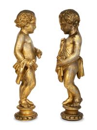 A Pair of Continental Giltwood Figures of Putti