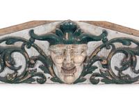 A Carved and Painted Pine Pediment Panel