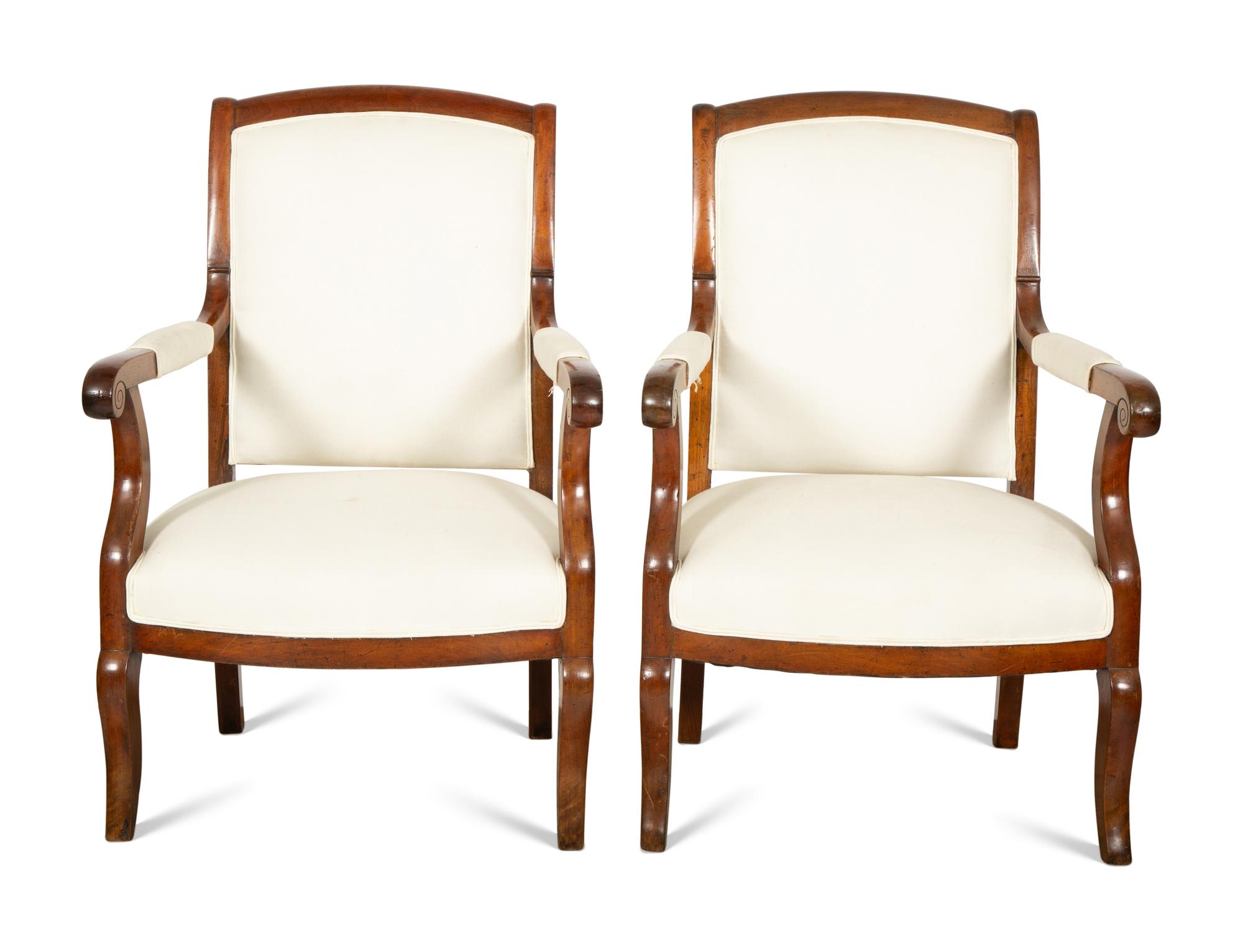 A Pair of French Walnut Fauteuils