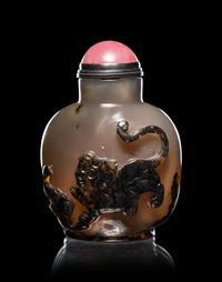 Two Carved Agate 'Fu Lion' Snuff Bottles