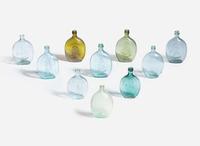 A collection of ten mold-blown colored glass bottles, various makers, 19th century