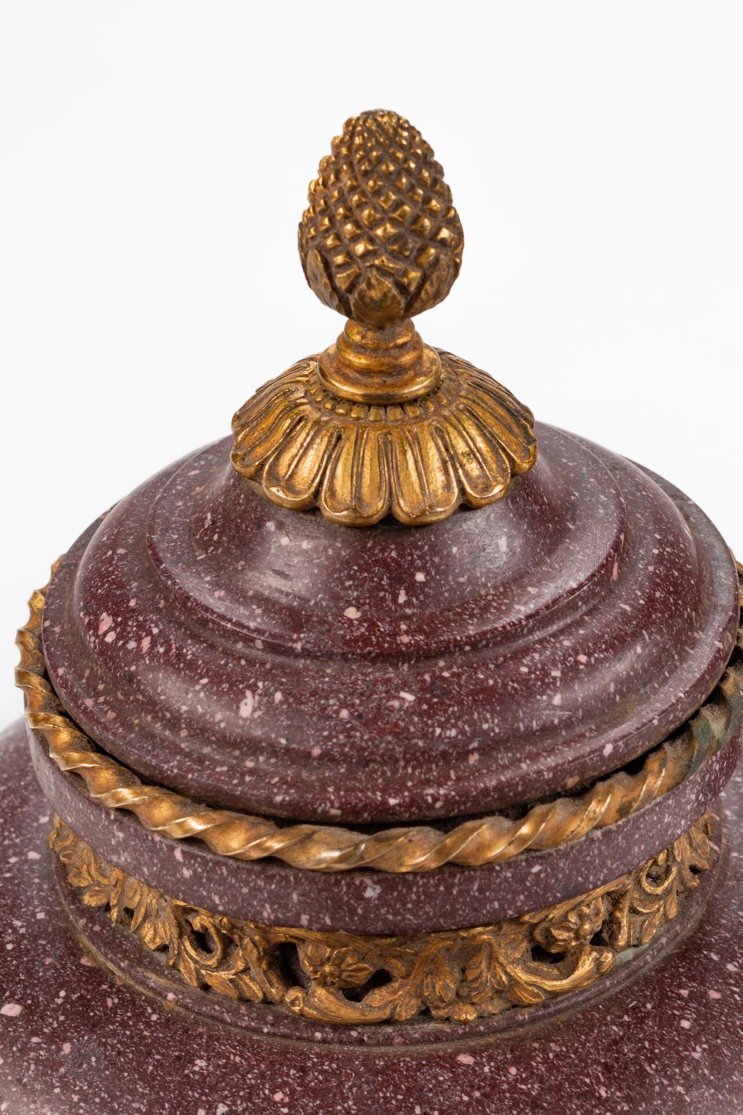 A Pair of Neoclassical Style Gilt-Bronze-Mounted Porphyry Urns
