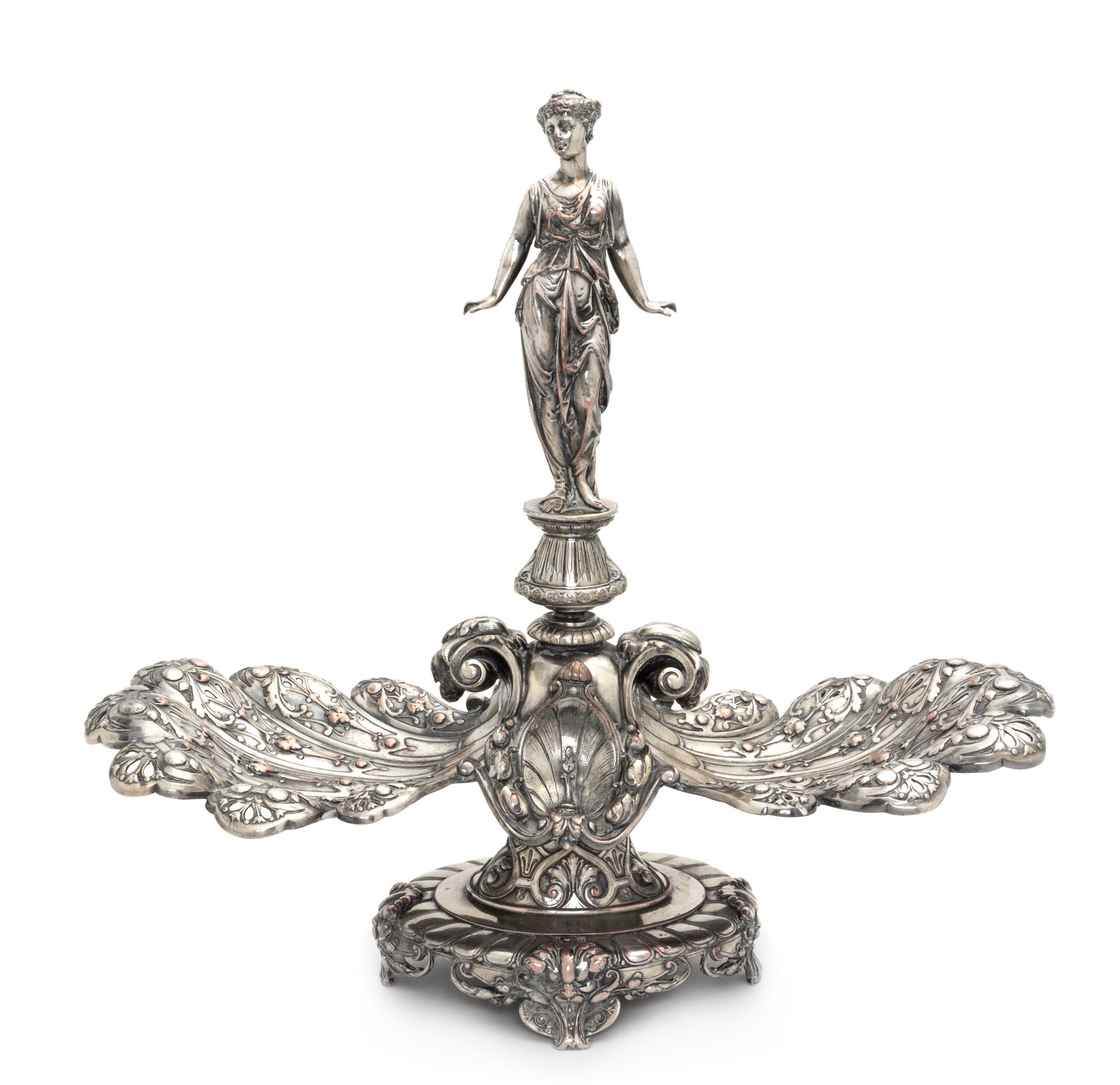 An English Silver-Plate Centerpiece, Elkington & Co., Birmingham, 19th Century, the central figure in the form of a draped maiden flank