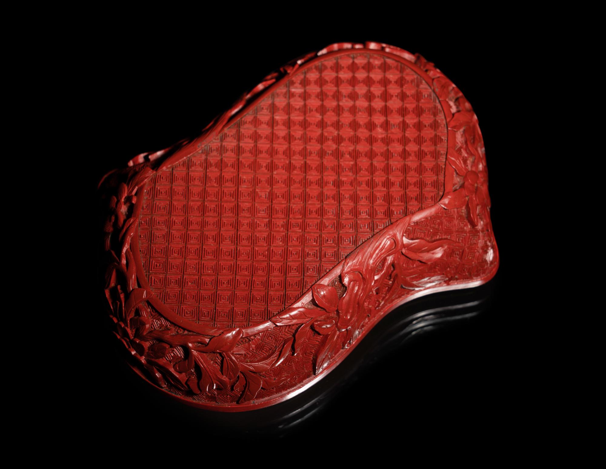 A Chinese Cinnabar Lacquer Double-Peach Form Box and Cover