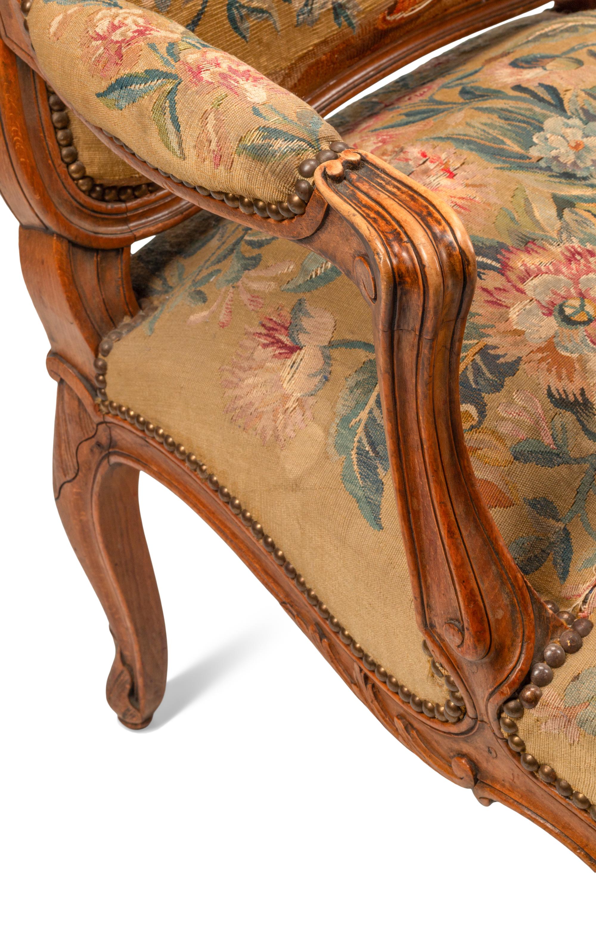 A Pair of Louis XV Style Beechwood Fauteuils