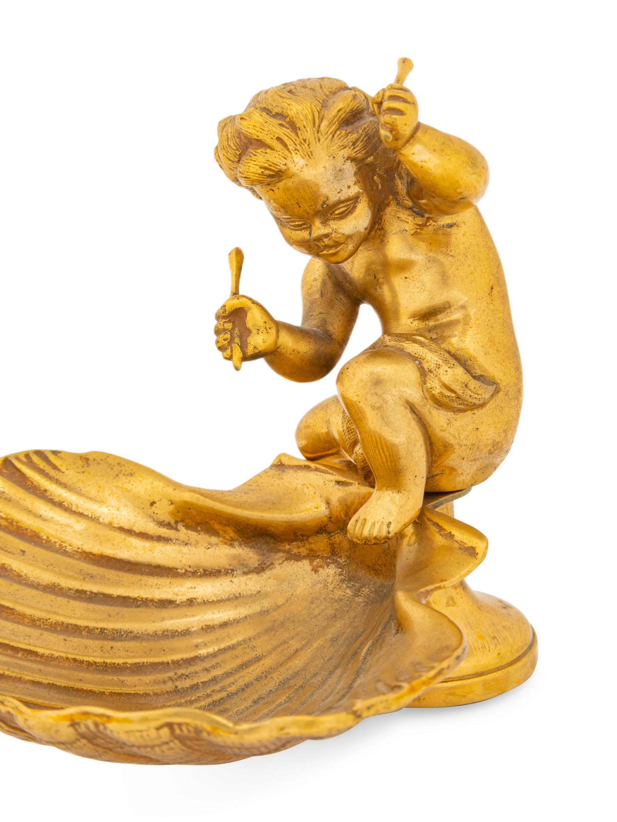 A Pair of Continental Gilt Bronze Putto and Shell Ornaments