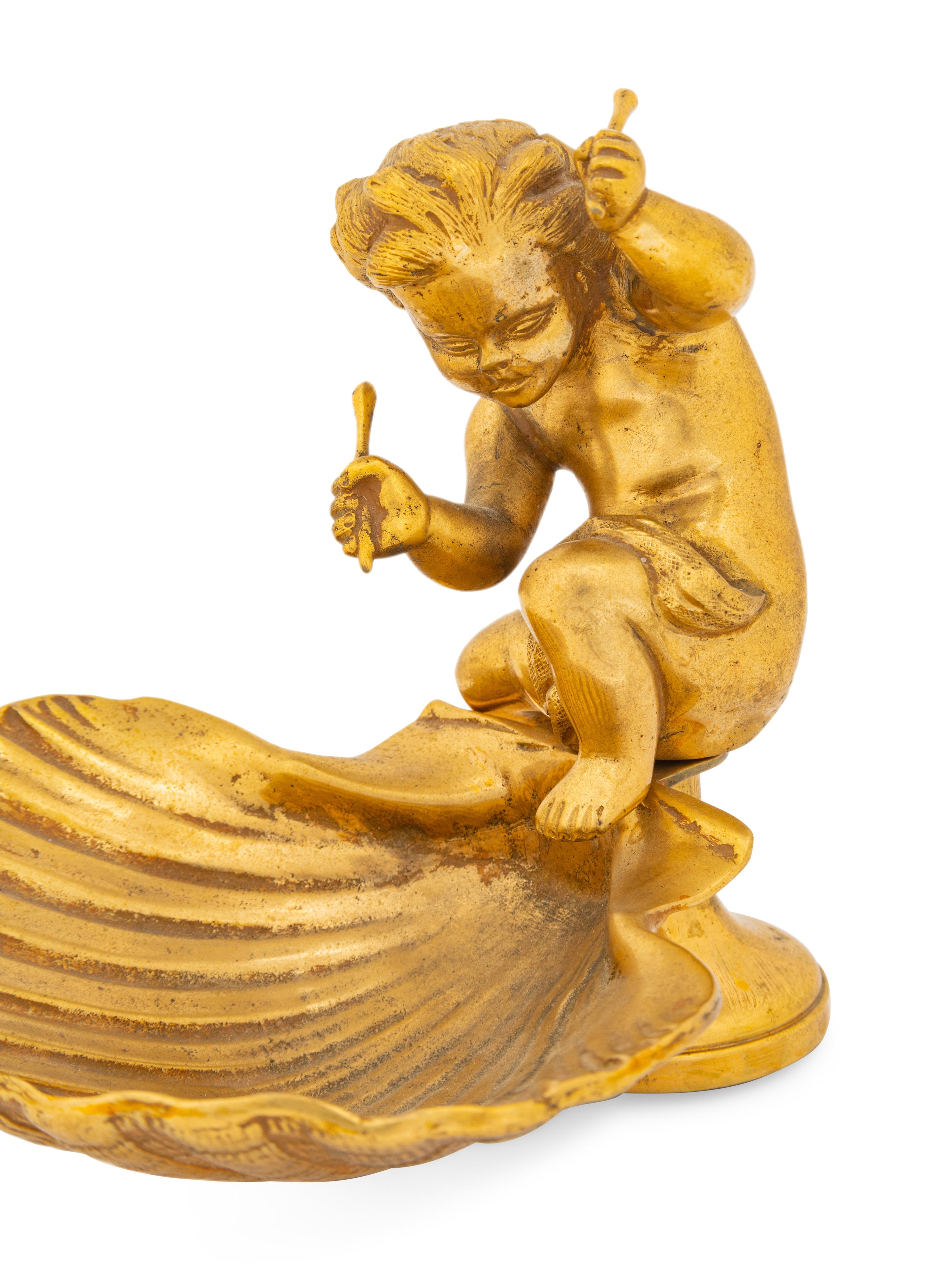 A Pair of Continental Gilt Bronze Putto and Shell Ornaments