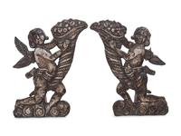 A Pair of Silver Clad Figures of Angels