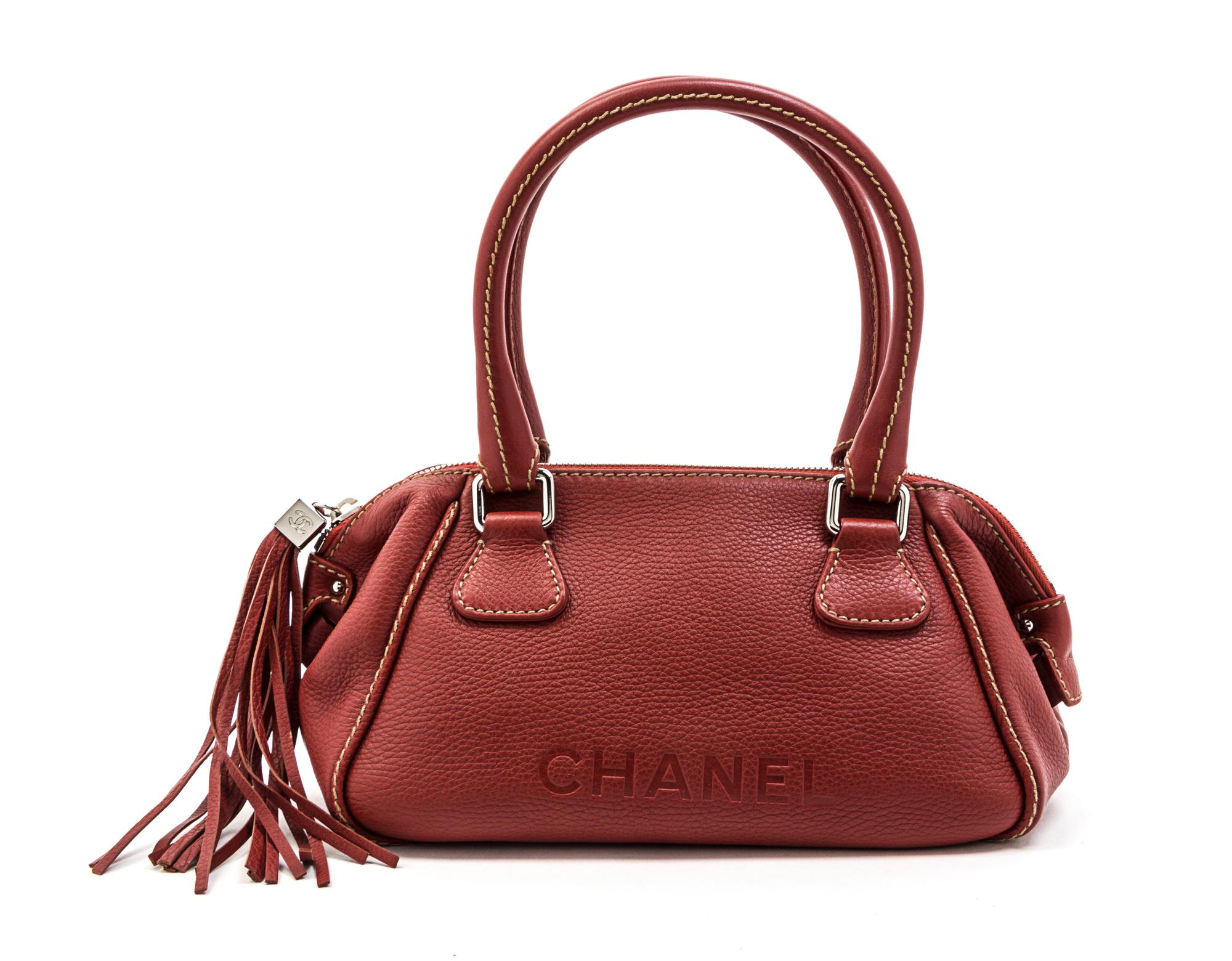 A Chanel Red Stitched Leather Bag, 13 x 6 x 5 1/2 inches.
