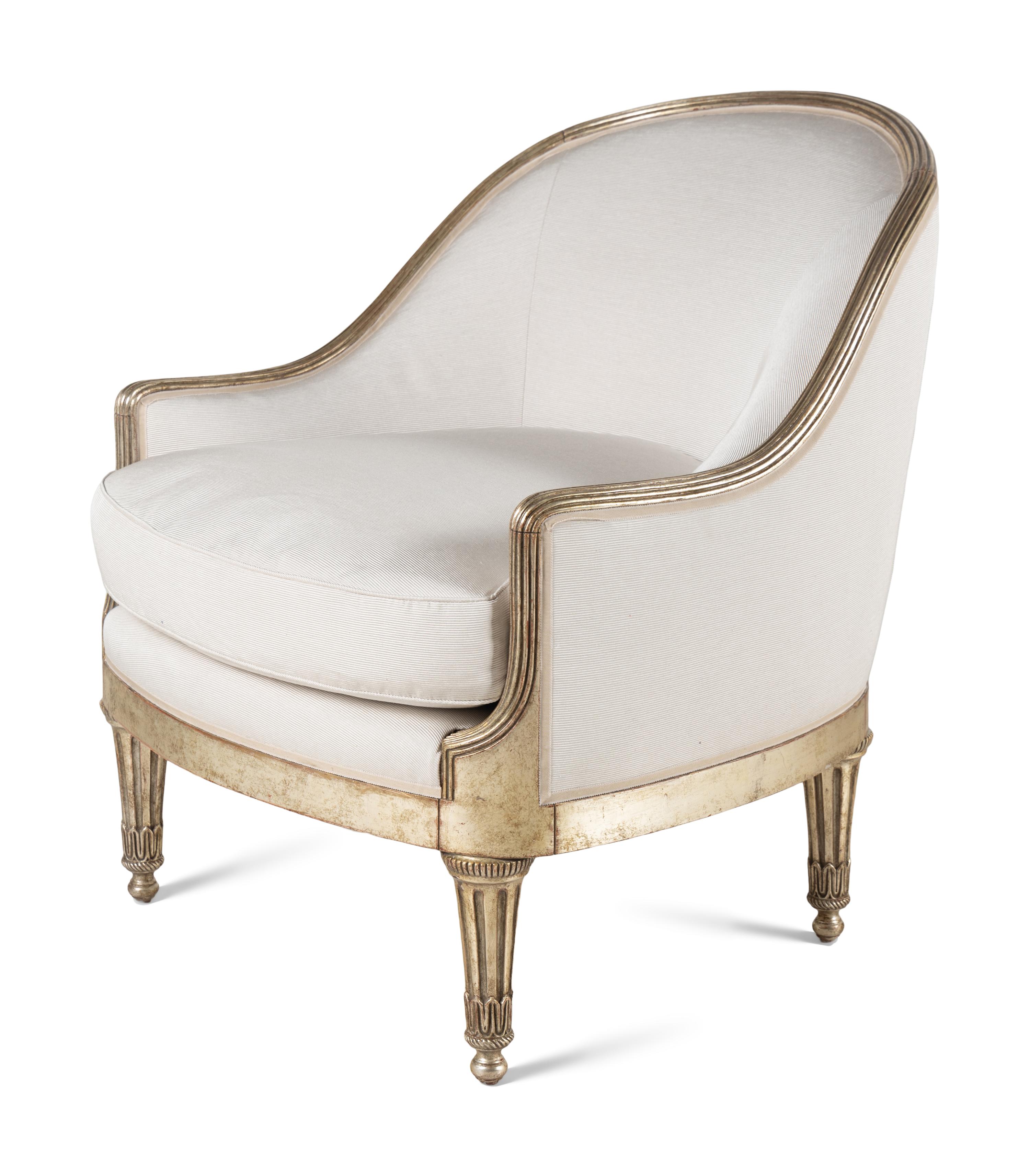 A Pair of Ebanista Silvered Wood Bergeres