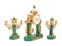 A Gilt Bronze and Malachite Veneered Clock Garniture
