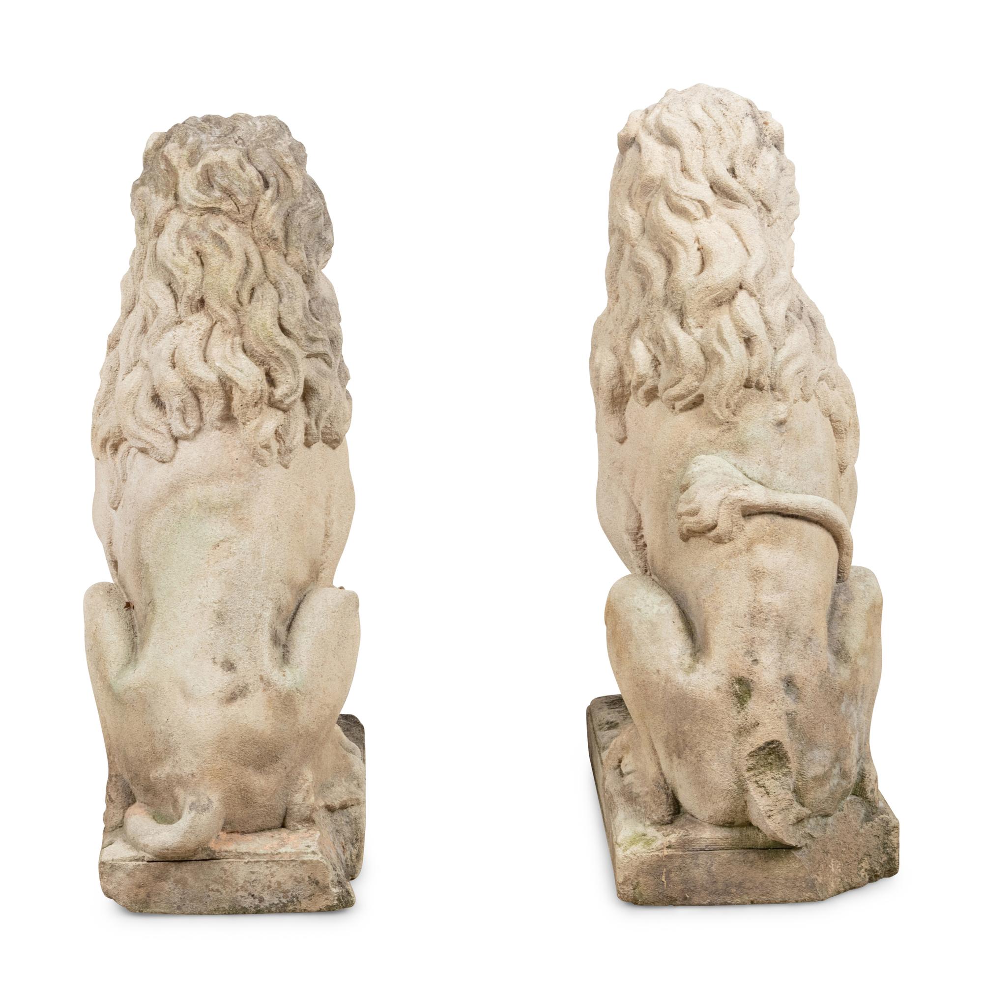 A Pair of Cast Stone Model Lions