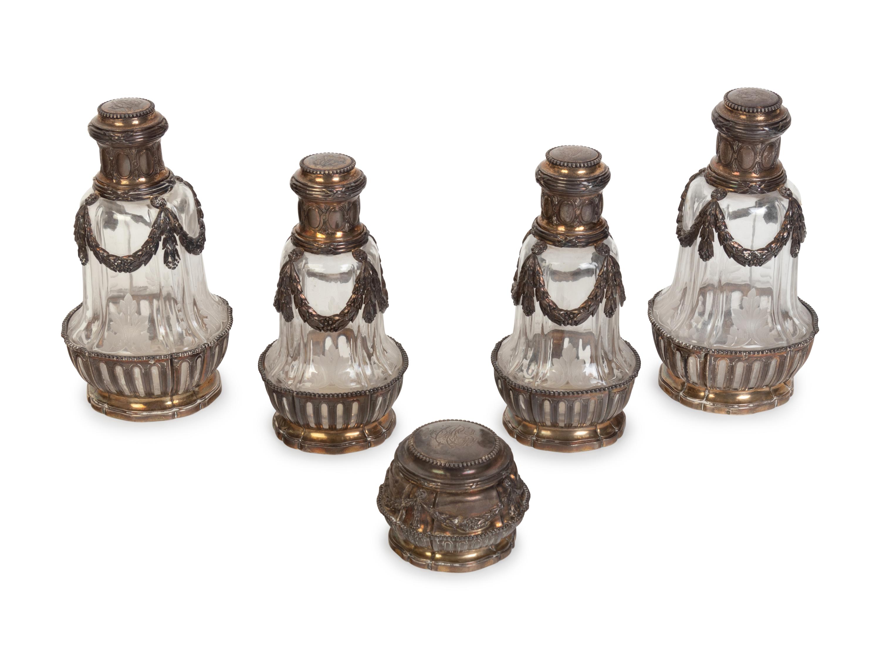 A Group of Four French Silver-Mounted Cut Glass Decanters
