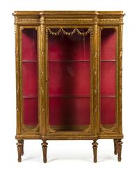 A Louis XV Style Giltwood Vitrine, Height 66 1/4 x width 49 1/2 x depth 16 1/2 inches.