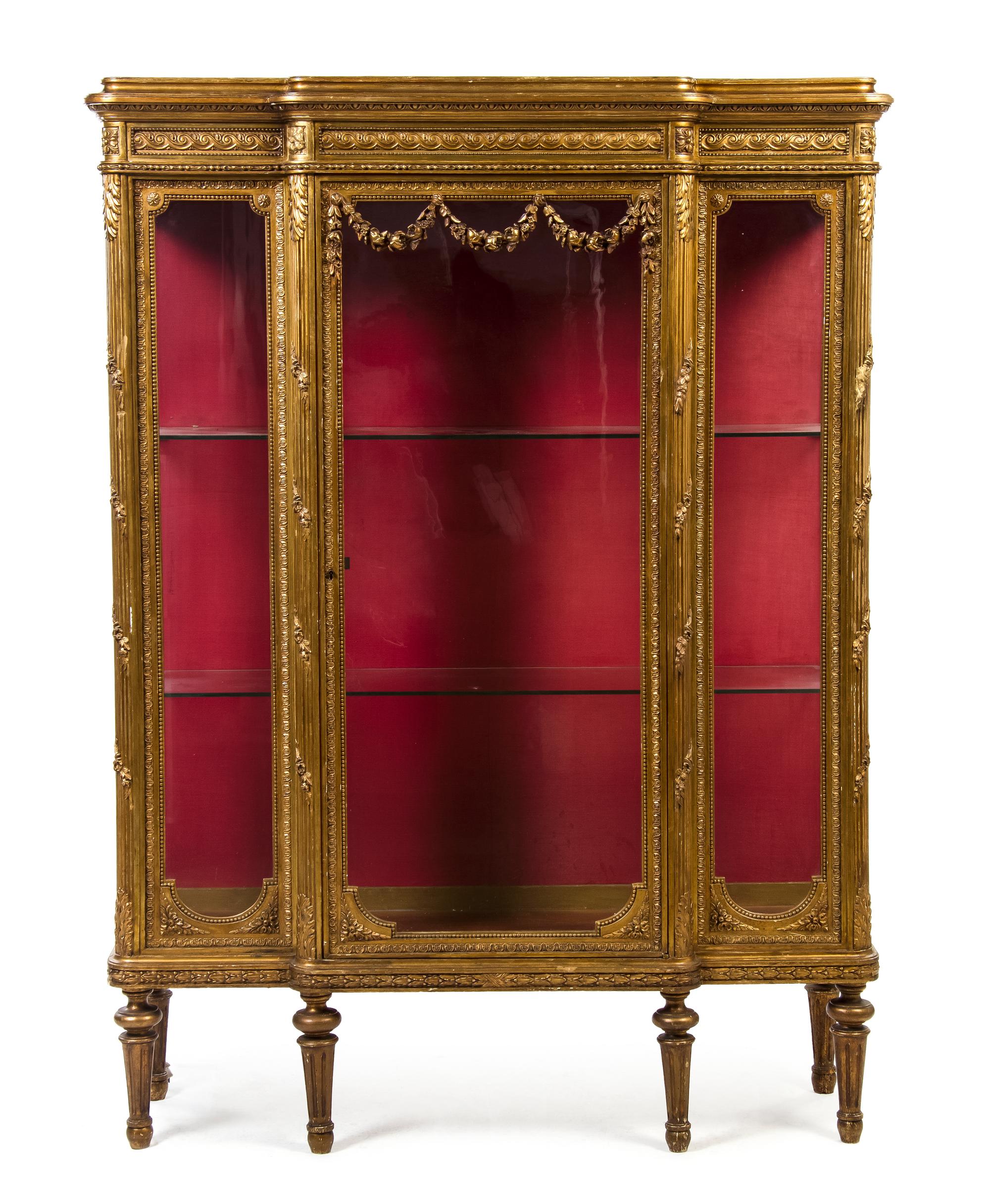 A Louis XV Style Giltwood Vitrine, Height 66 1/4 x width 49 1/2 x depth 16 1/2 inches.