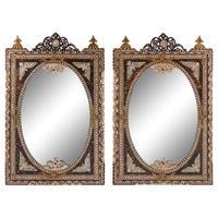 A Pair of Iberian Marquetry Oval Mirrors
