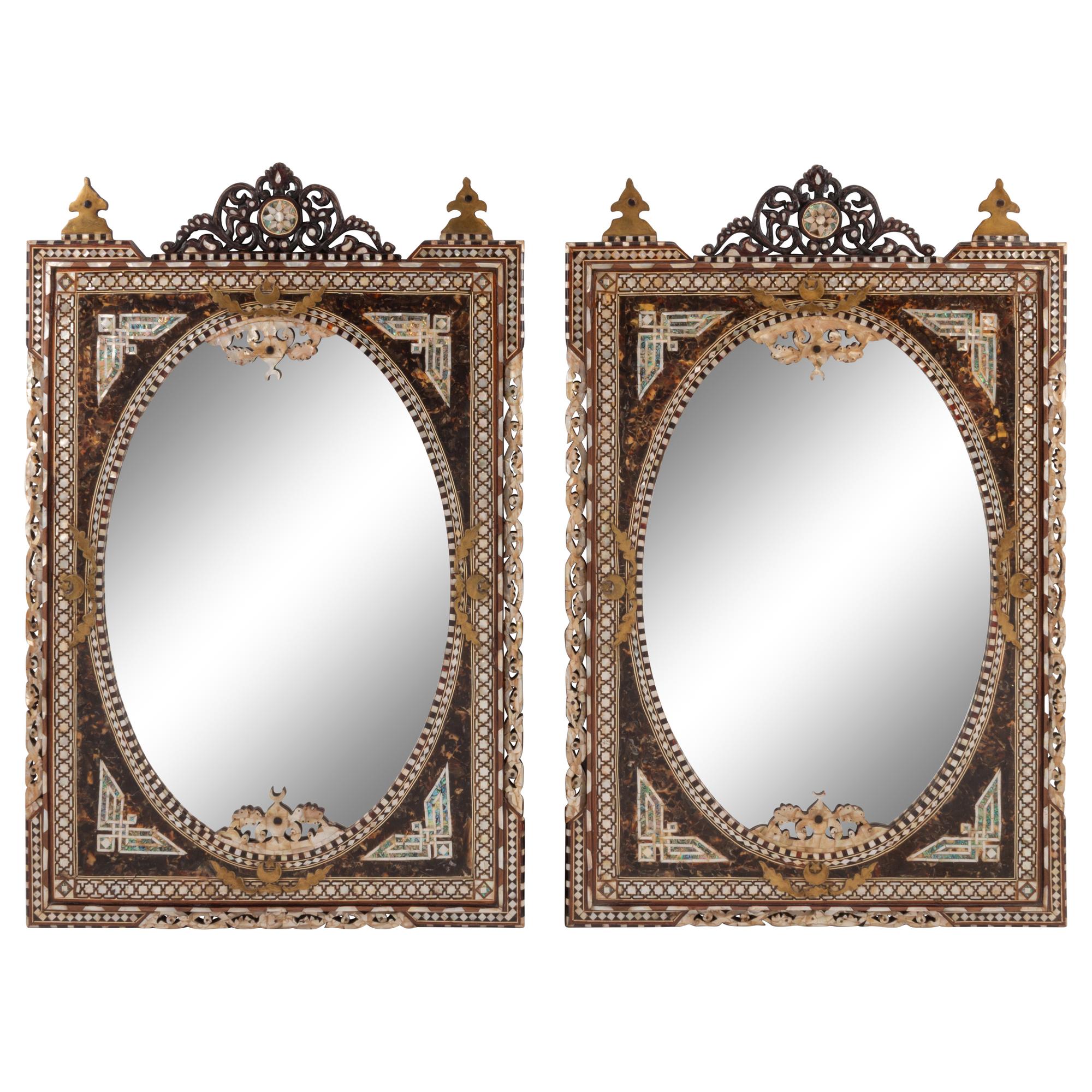 A Pair of Iberian Marquetry Oval Mirrors