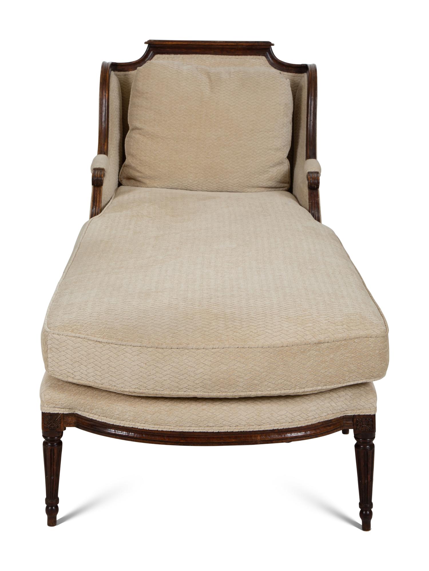 A Louis XVI Carved Walnut Chaise Longue
